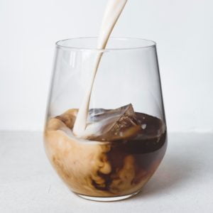 clear drinking glass with brown liquid