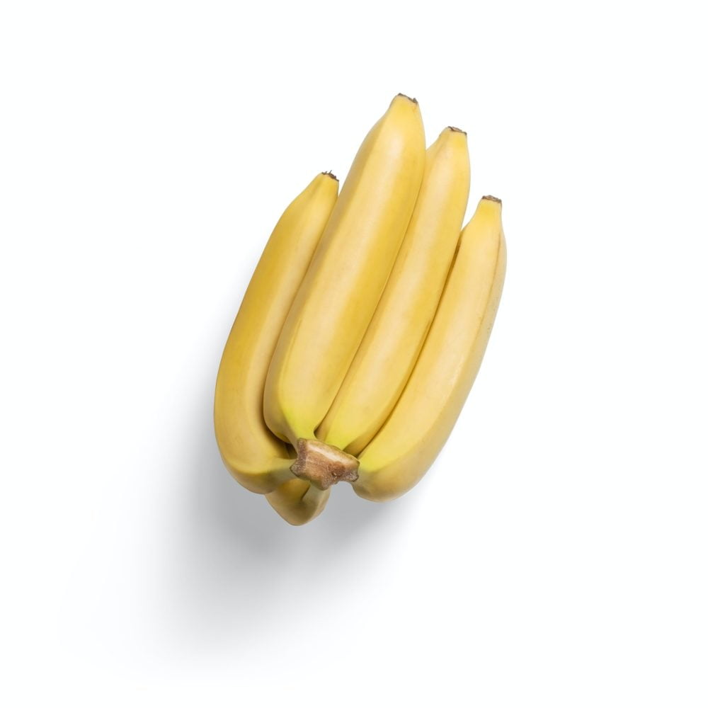 3 yellow banana fruits on white surface